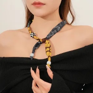 Vintage bohemian floral print scarf necklace with amber resin pendant and marble accents