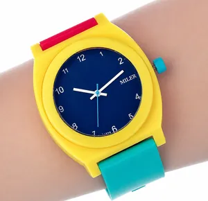 Close-up of a colorful MILER quartz watch with yellow case and tricolor silicone strap