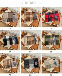 Selection of nine classic British style plaid scarves in various colors with fringe details