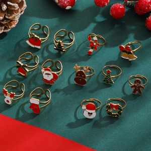 Close-up of 6-piece Christmas enamel rings set featuring reindeer and tree motifs