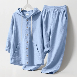 Close-up of light blue linen hooded shirt with wooden buttons and natural muslin texture