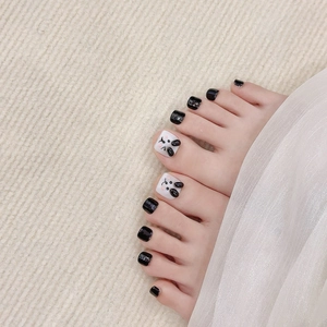 Handmade press-on toenails featuring black glossy finish and 3D panda cartoon designs