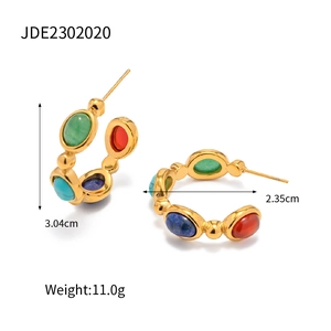 Detailed view of vintage C-shaped earrings with colorful natural stones and 18K gold plating