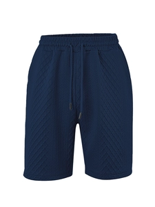 Detailed view of dark blue men's casual shorts featuring waffle texture and drawstring waist