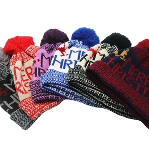 Knit Christmas beanie with Merry Christmas text and pom pom in multiple colors