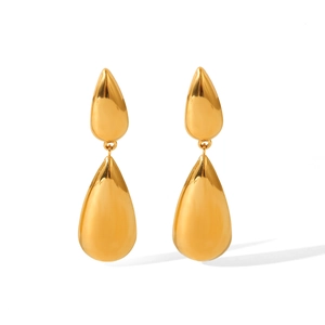 Close-up of golden teardrop earrings with a polished finish and elegant double-drop design