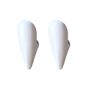 Realistic white vampire fangs prop for Halloween costume party accessories on white background