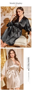 Detail view of luxurious satin nightgown in black and champagne gold with tie waist