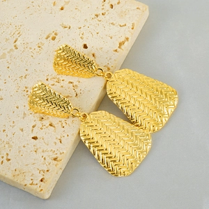 Gold woven texture geometric earrings in 18k plated stainless steel on stone