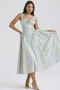 Detail of blue floral halter dress with lace trim showing the flowy silhouette and drape