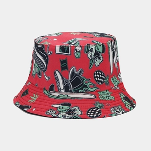 Detail of red bucket hat featuring street graffiti prints and FEEL WILD text design