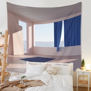 Detail of bohemian tapestry featuring sea view windows hung above a bedroom headboard