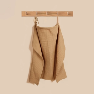 Detail of waffle weave nursing cover with adjustable neck strap in warm camel brown color