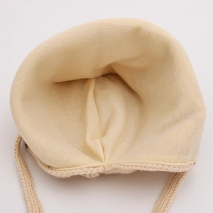 Beige baby knitted earflap hat with soft cotton lining and secure chin ties