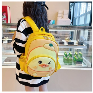 Detail of yellow cartoon duck backpack with durable EVA hard shell and side mesh pockets
