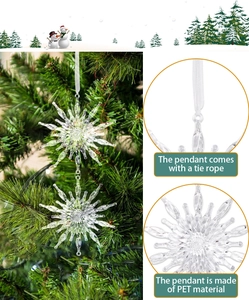 Close-up of transparent PET snowflake ornaments with tie ropes for Christmas tree decor