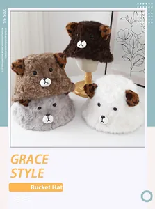 Detail of plush animal bucket hats in brown, grey and white with cute 3D ears