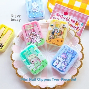 Macro view of macaron-colored 2-piece mini nail clipper set with cute cartoon patterns