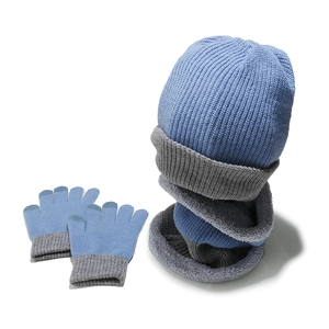 Detail of blue knitted winter set with thick fleece lining and touchscreen glove tips