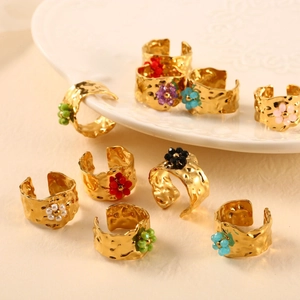 Golden hammered wide open rings featuring colorful beaded flower charms in 9 styles