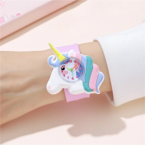 Close-up of pink unicorn snap watch featuring soft silicone band and clear numeric dial