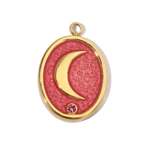 Detailed view of pink enamel moon pendant with gold trim and crystal for DIY jewelry