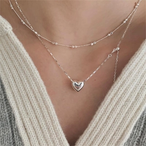 Minimalist 925 sterling silver layered heart pendant necklace for women on knitwear