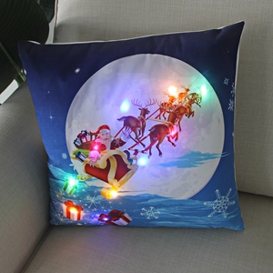 Detailed view of LED lighted Christmas pillow with Santa sleigh on soft plush fabric