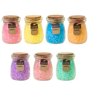Set of seven colorful Himalayan bath salt glass bottles with cork stoppers and love tags