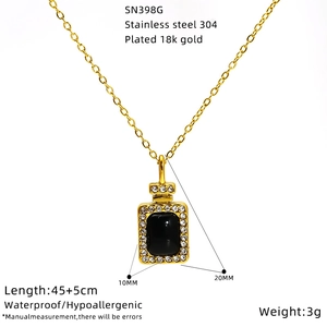 Detail view of 18K gold plated perfume bottle pendant with size dimensions and black gem