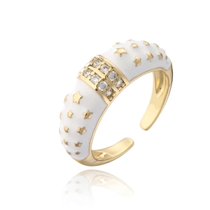 Detail of bohemian gold adjustable ring with white enamel stars and double row zircons