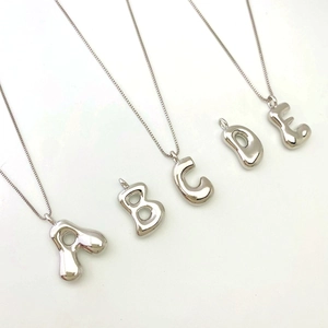 Silver balloon initial necklaces with bubble A to E alphabet charms on thin chains