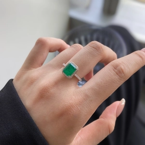 Luxurious S925 silver ring with emerald-cut green zircon and shimmering pavé diamonds