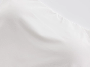 Close-up detail of soft white high-elastic fabric with breathable and smooth texture