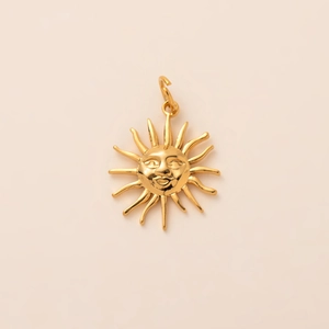 Detailed close-up of a 18K gold-plated stainless steel sun pendant with a smiling face