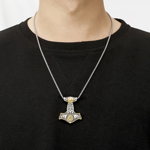 Men's Viking Mjolnir necklace featuring twin wolf motifs and compass runes in gold and silver