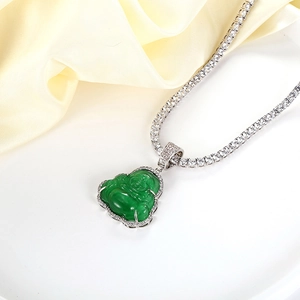Close-up of green jade Buddha pendant with sparkling cubic zirconia tennis chain