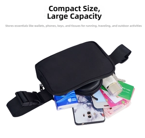 Detailed view of spacious nylon sports waist bag interior showing multiple storage items