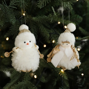 White plush snowman and girl Christmas tree ornaments with wooden skis and warm lights