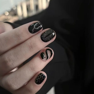 3D snake and cat-eye short press-on nails with dark gothic aesthetic in black and silver
