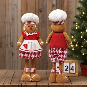 Christmas gingerbread man chef dolls with telescopic legs on a warm festive background