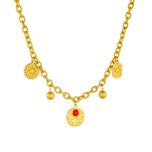 Vintage gold geometric pendant necklace with sunburst charms and red gemstone accent