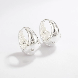 Close-up of S925 sterling silver hoop earrings featuring sparkling star-set zircon stones