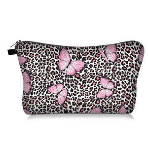 Detail of a makeup bag with pink butterflies and leopard print and a black zipper closure