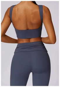 Detail of high-impact yoga sports bra back with U-shaped open design in blue matte fabric