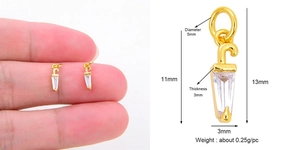 Macro view of gold copper umbrella pendant with dimensions and zircon inlay details