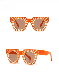Front and side view of orange sunglasses with tea lenses and decorative rice nail rivets