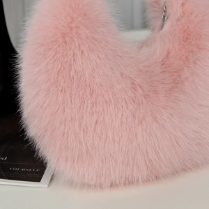 Close-up of the soft pink fluffy plush material on a large capacity shoulder bag