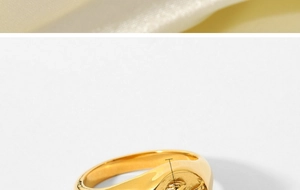 Detailed view of an 18k gold plated stainless steel signet ring with Cupid angel relief