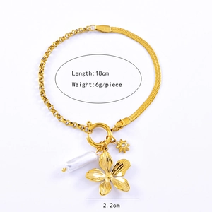 Detail view of gold chain bracelet with flower, star pendants and sizing measurements